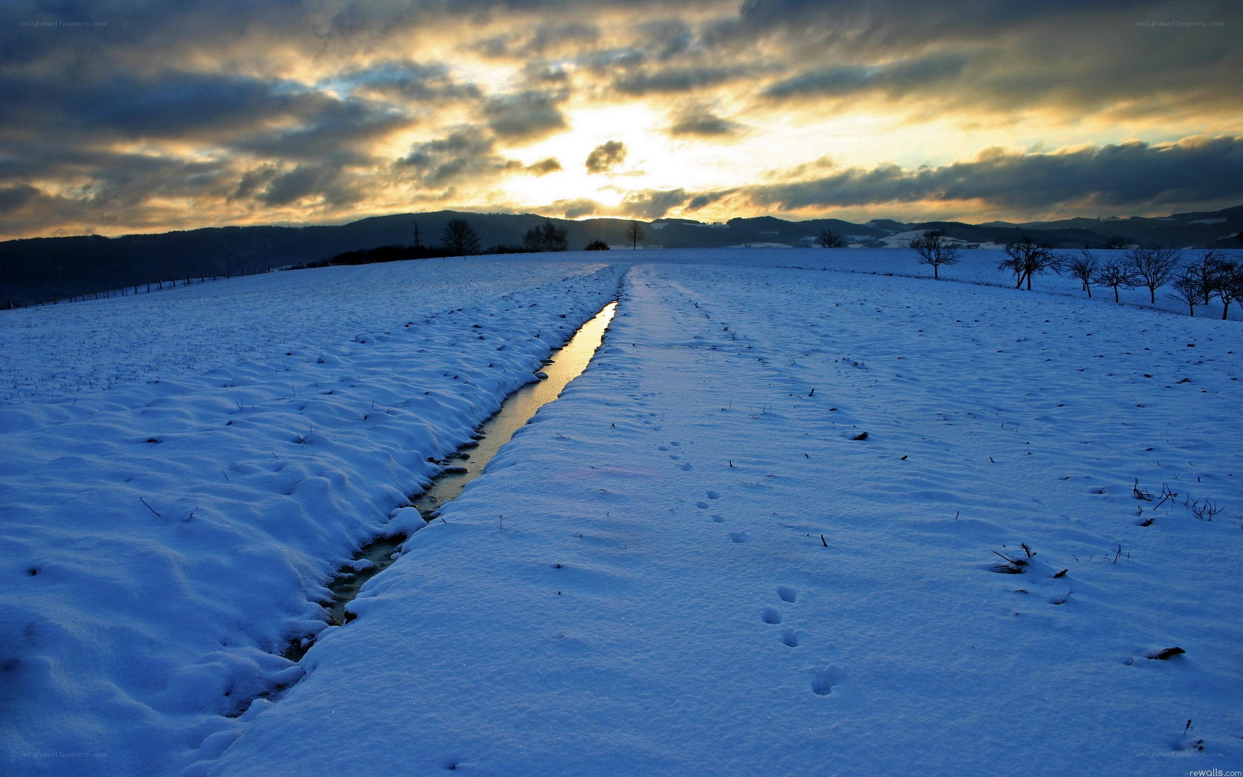 Snowy field at sunset