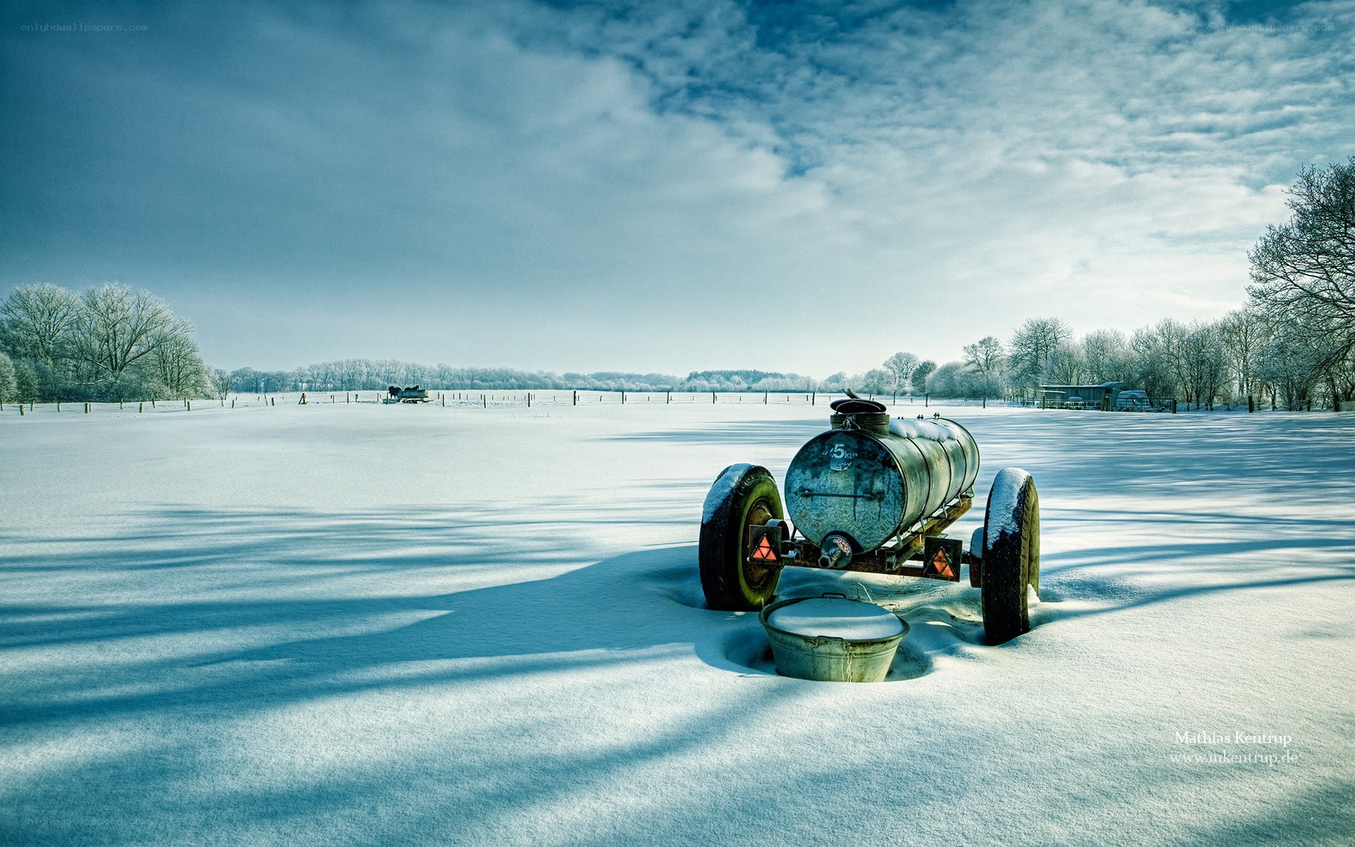 Snowy field with old tank
