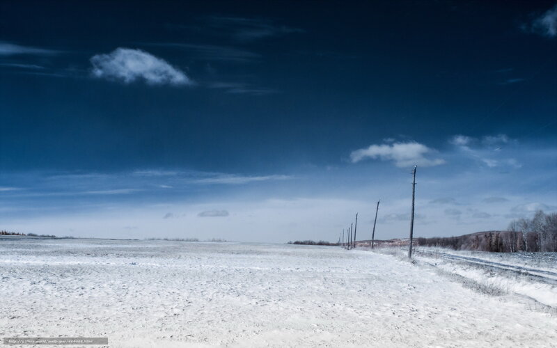 Snowy field with power lines