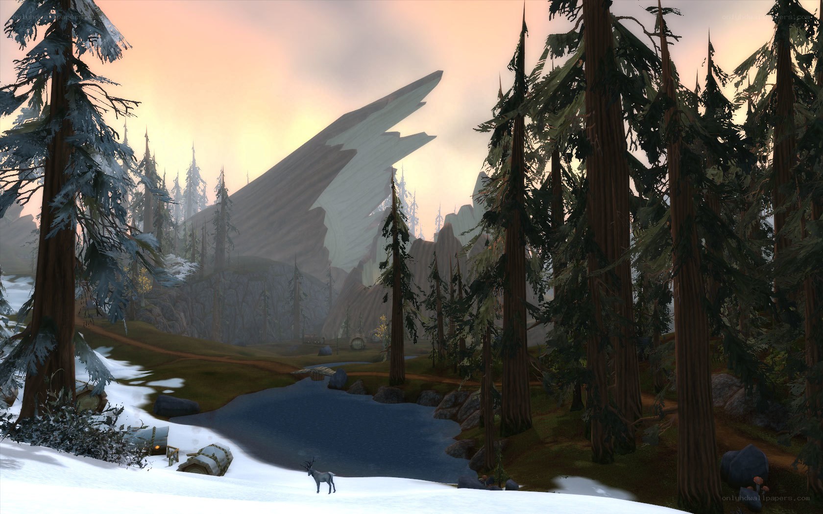 snowy forest with lake and mountain