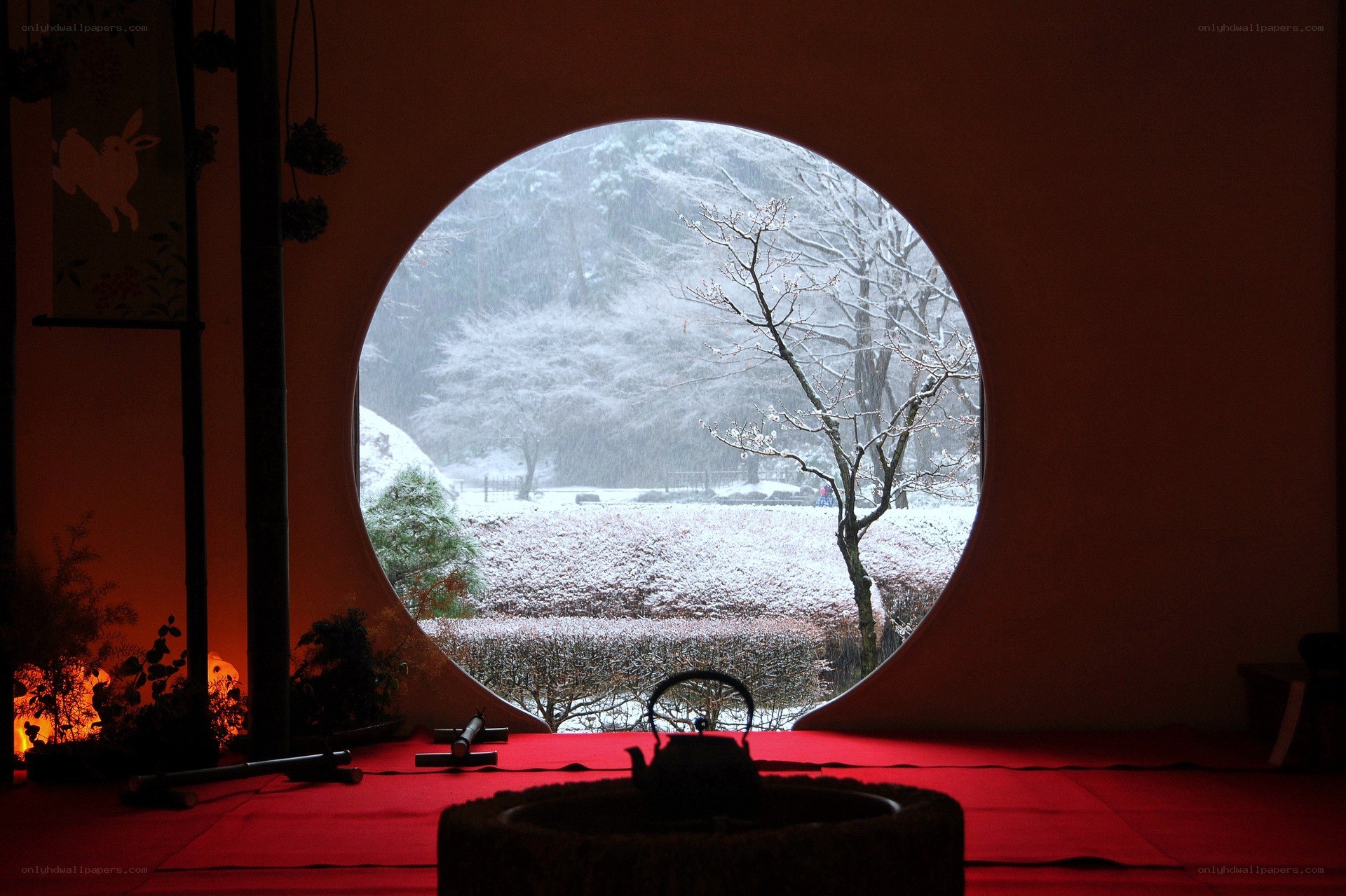 Snowy garden through a round window