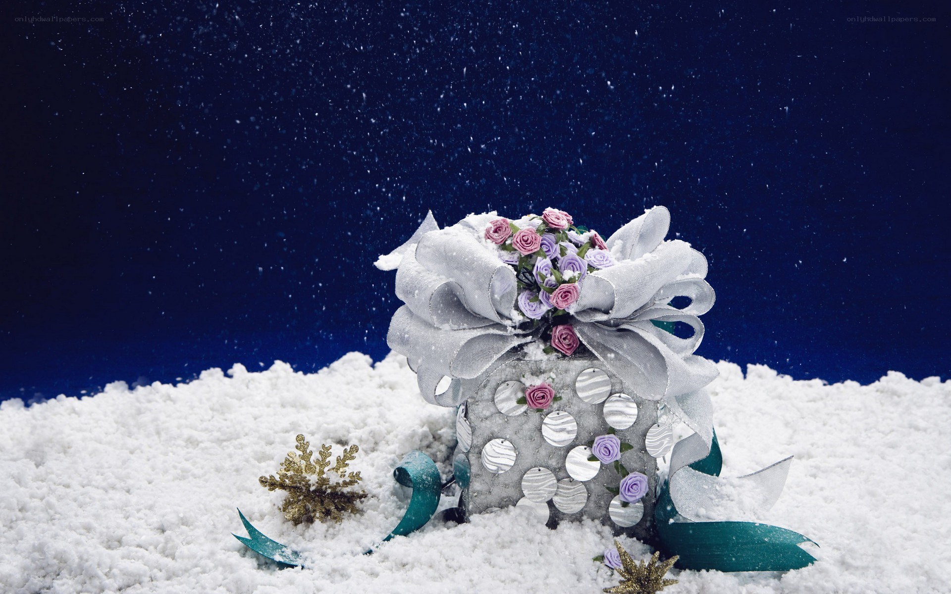 Snowy gift box with flowers