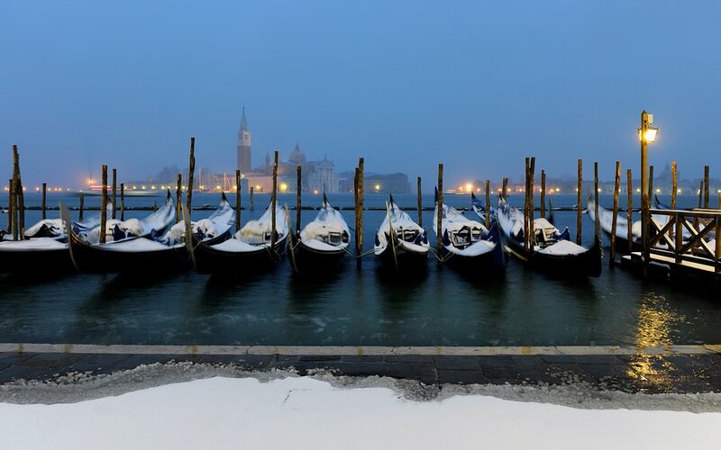 Snowy gondolas in Venice