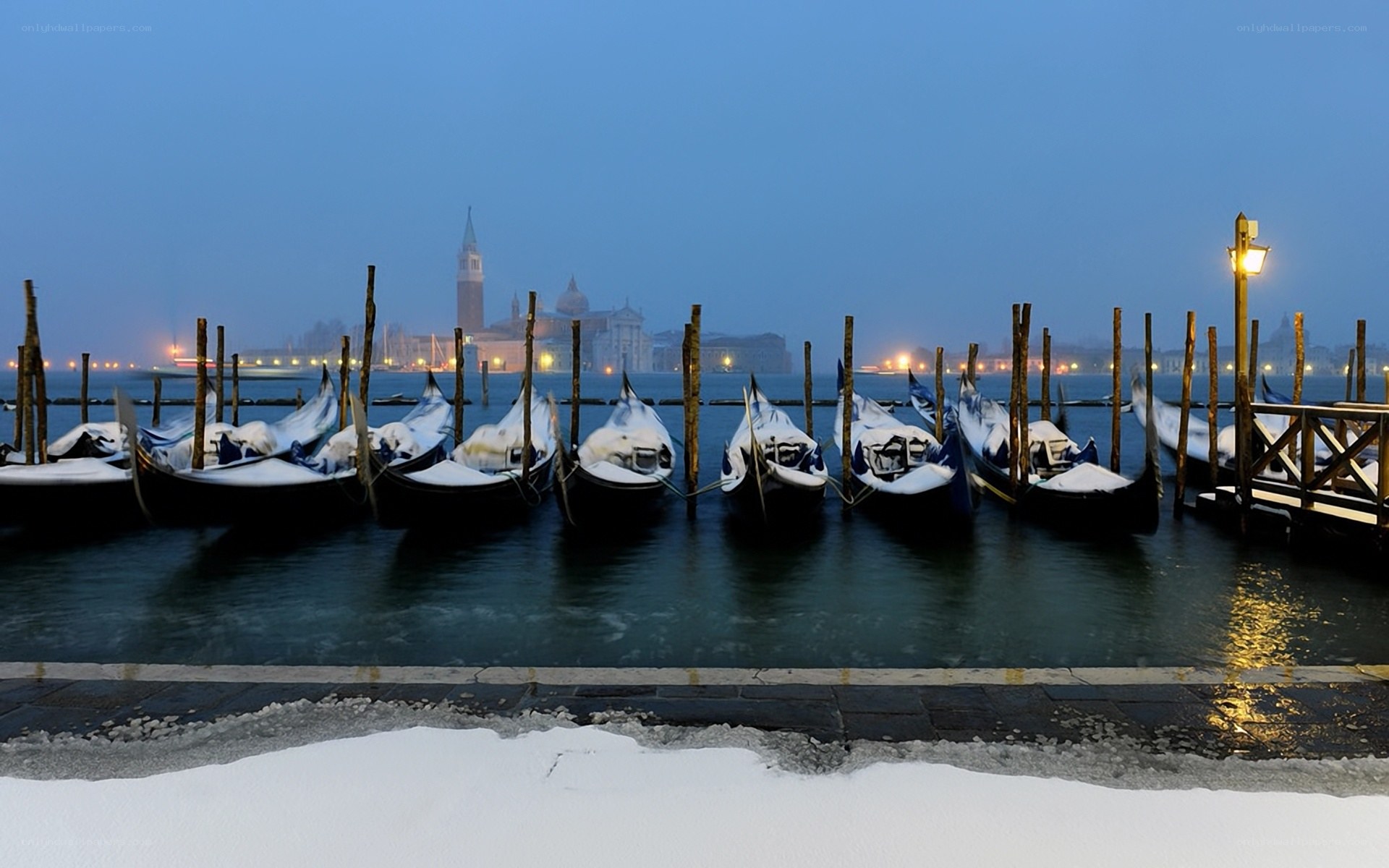 Snowy gondolas in Venice