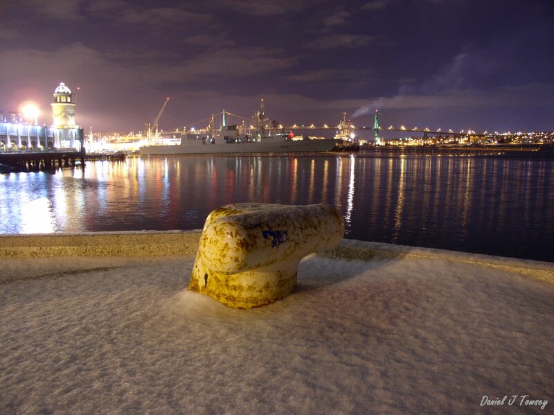 Snowy harbor at night