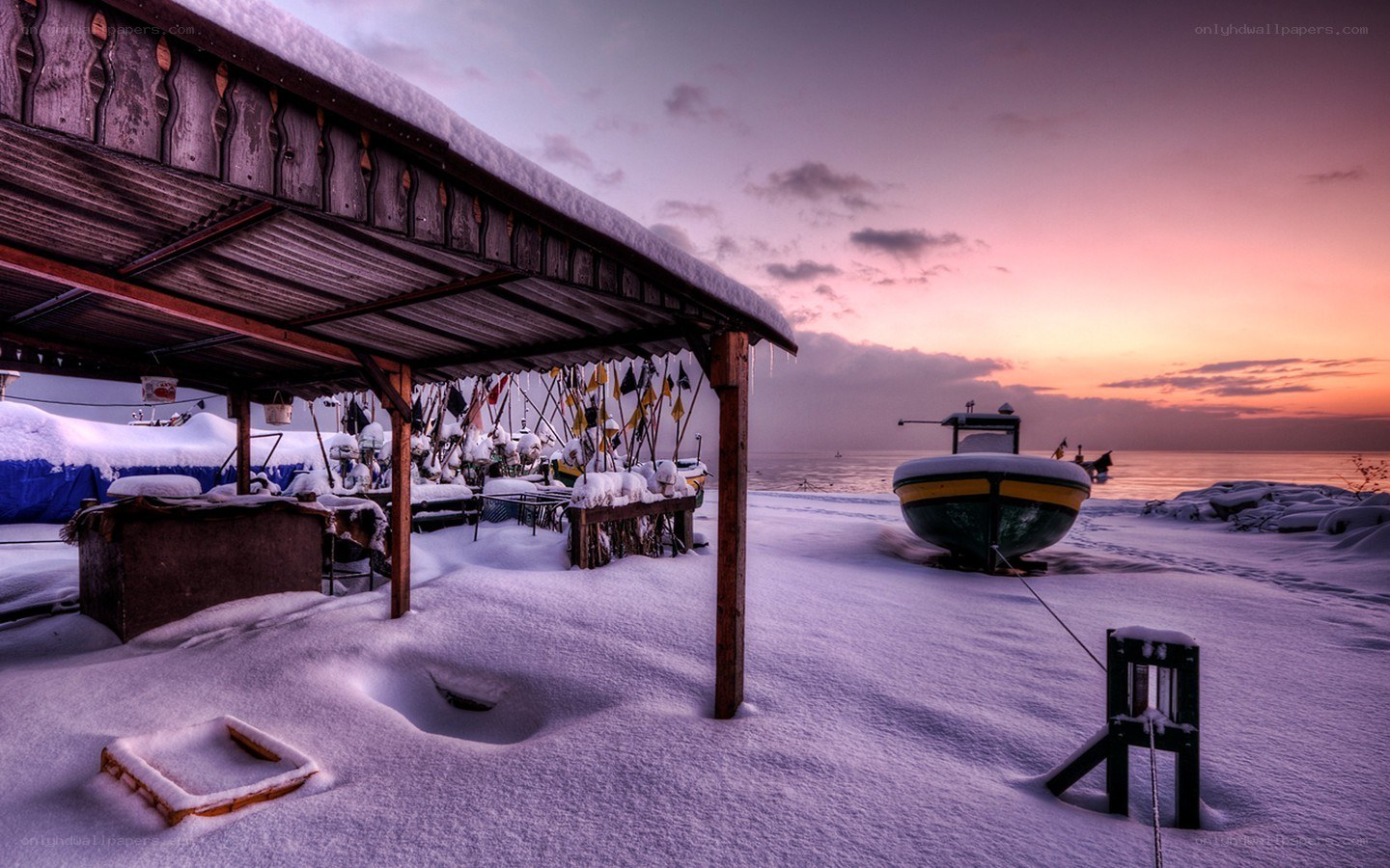 Snowy harbor at sunset