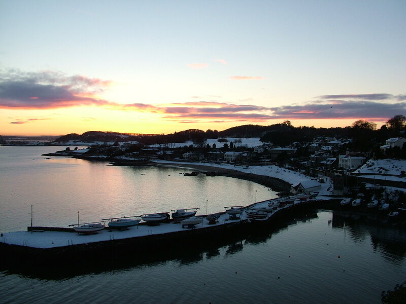 snowy harbor at sunset