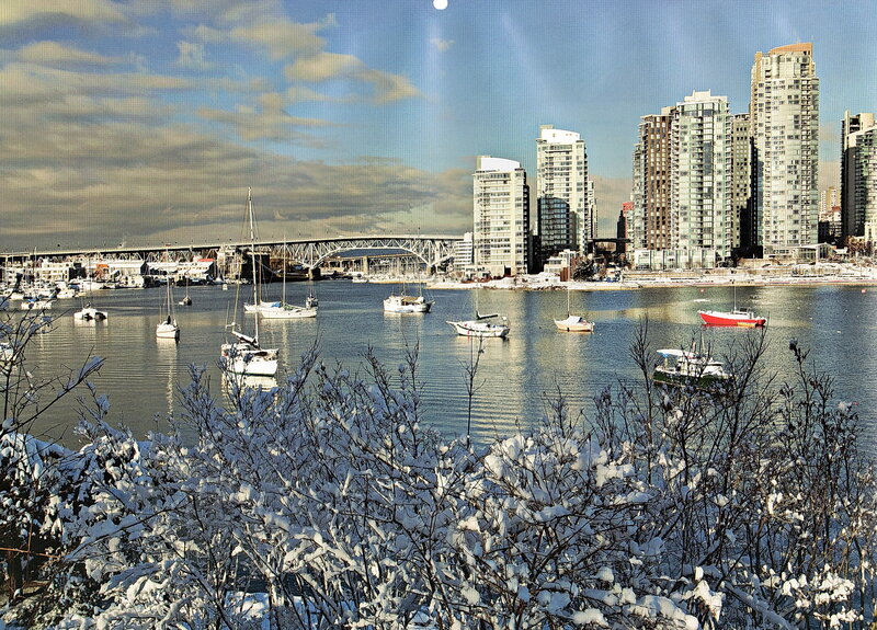 Snowy harbor with city skyline