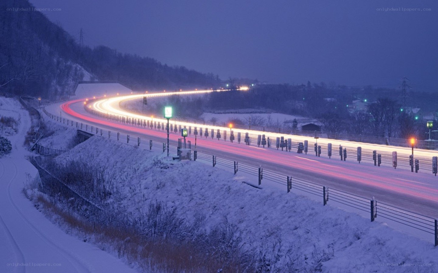 Snowy highway at night
