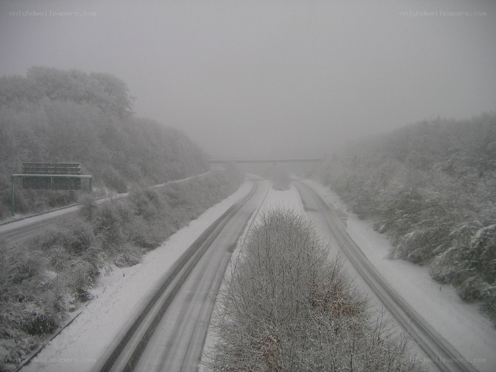 snowy highway in fog