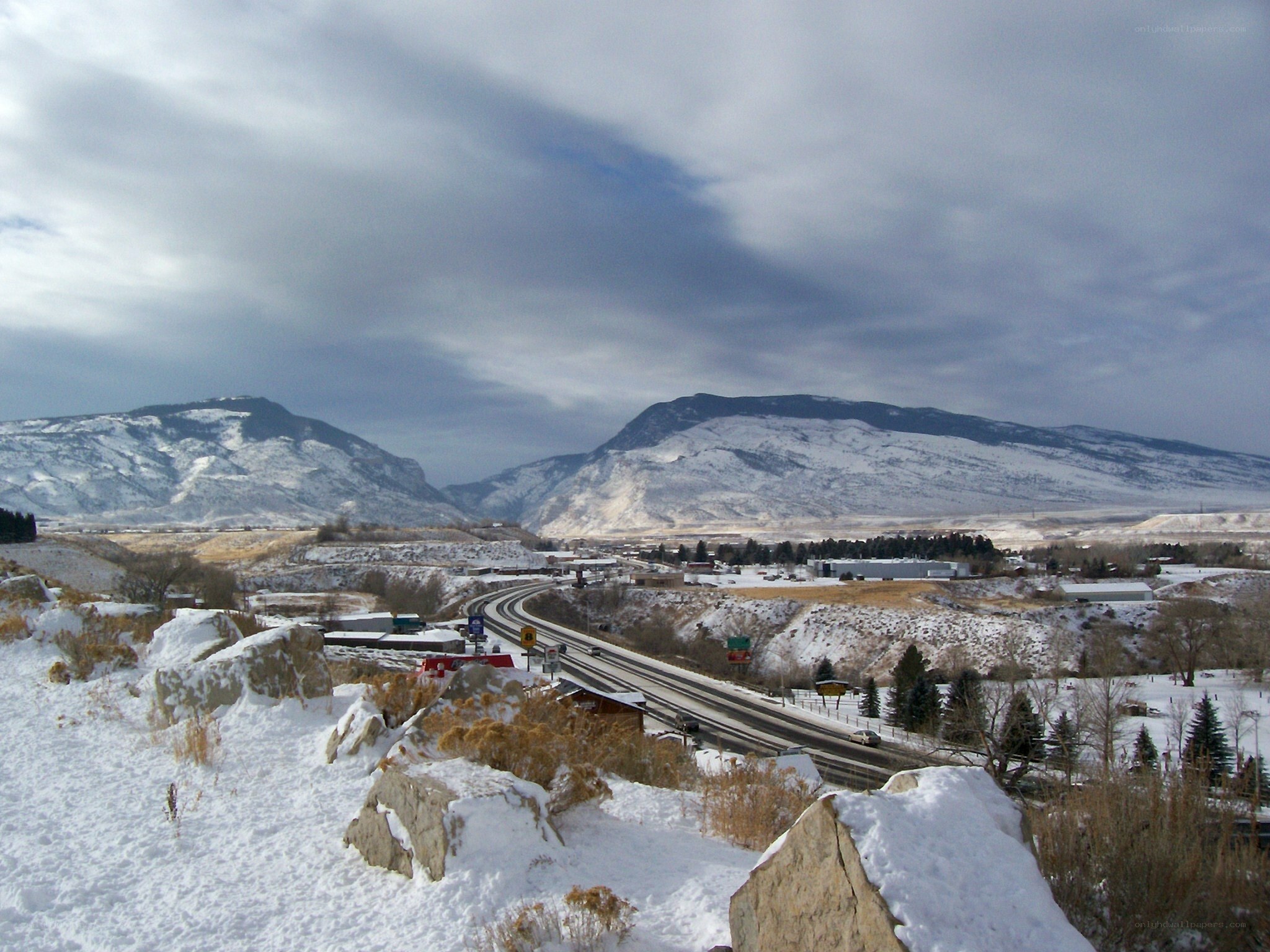Snowy highway in mountain valley