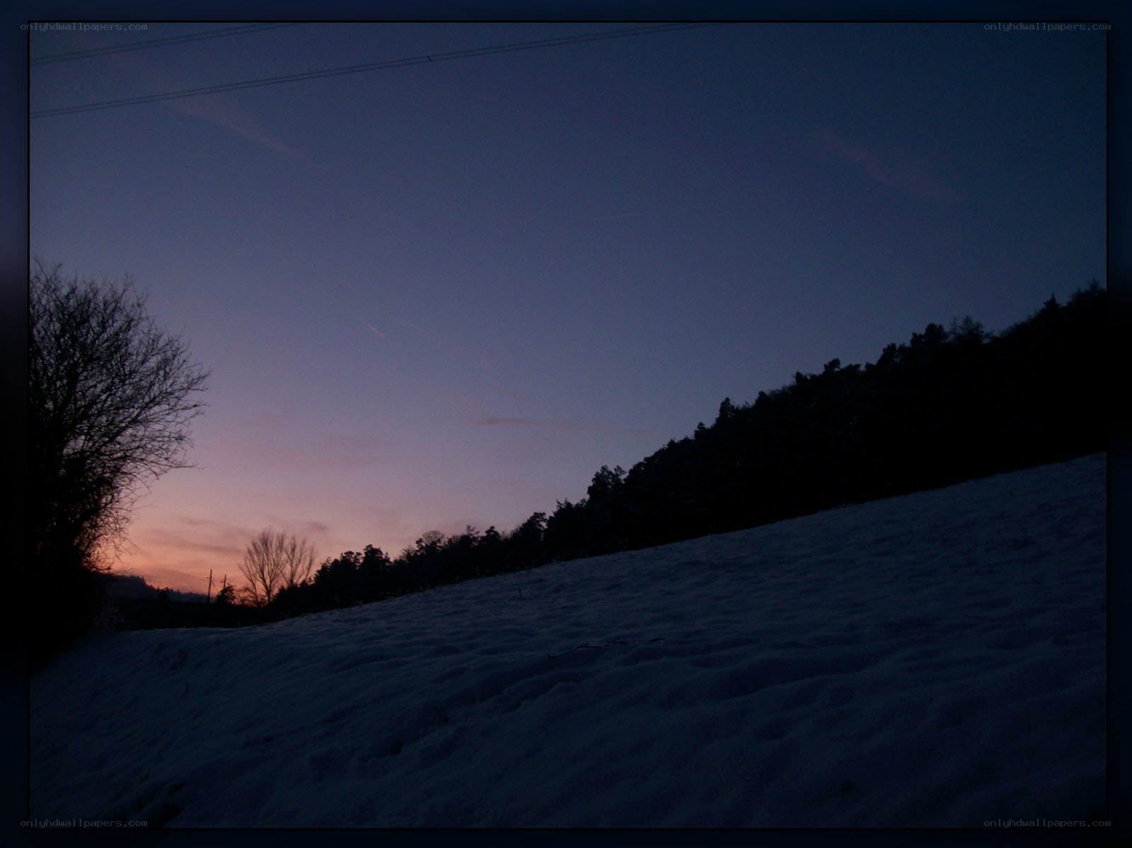 snowy hill at dusk