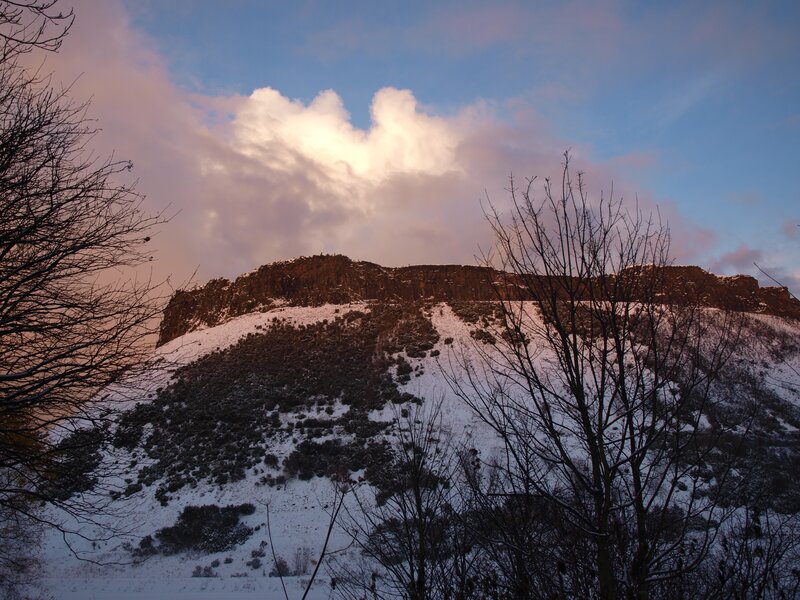 Snowy hill at sunset