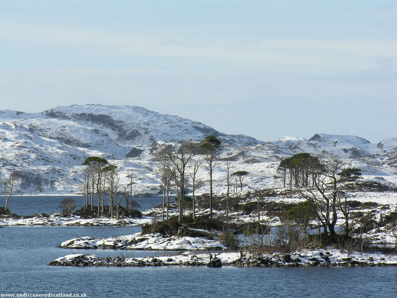 snowy hills by a loch