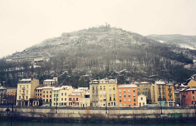 Snowy hillside town with fortress