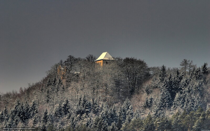 Snowy hilltop with house