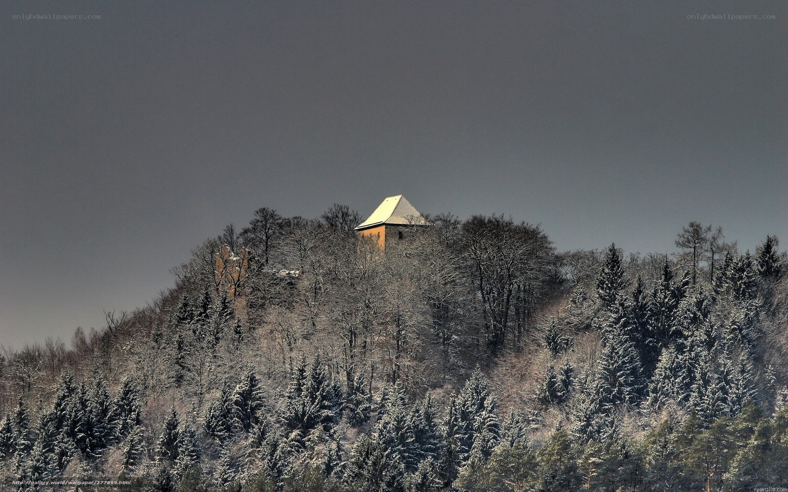 Snowy hilltop with house