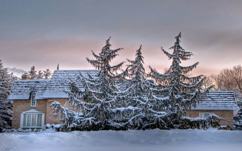 Snowy house at dusk