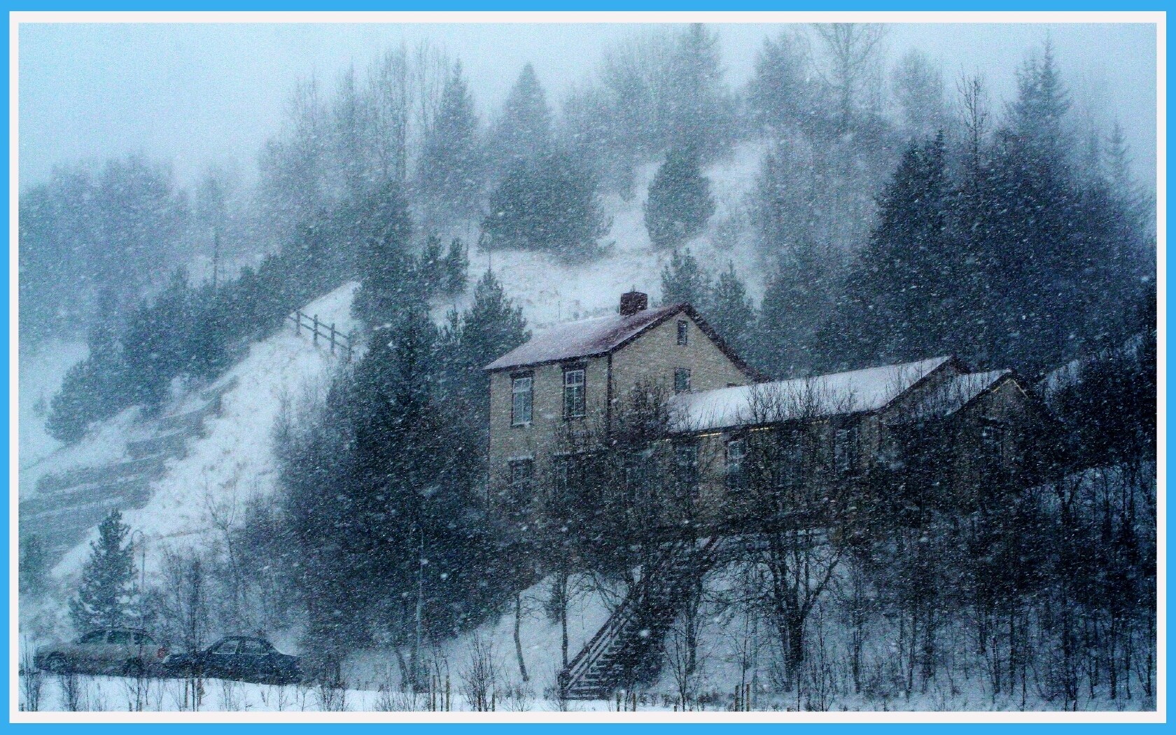 Snowy house on a hillside