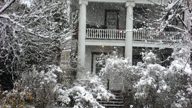 Snowy house with porch