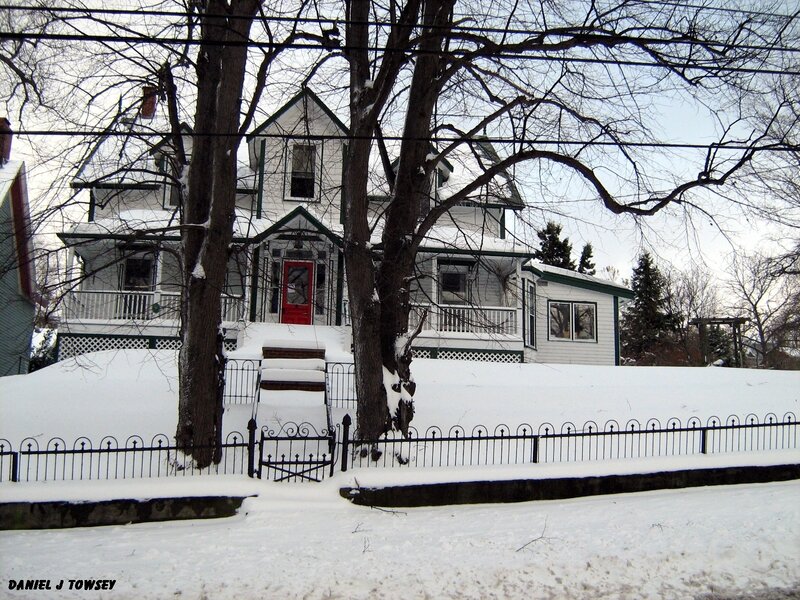 snowy house with red door