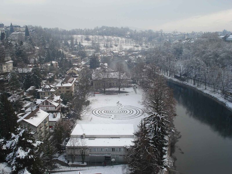 Snowy labyrinth by a river