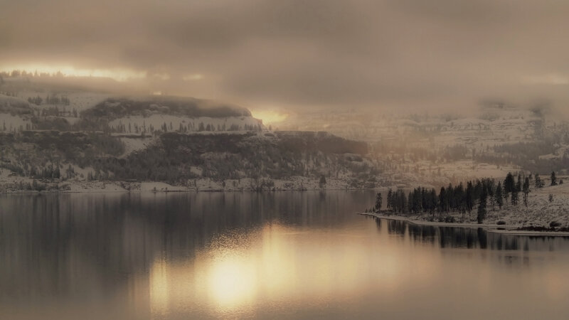 Snowy lake at sunrise
