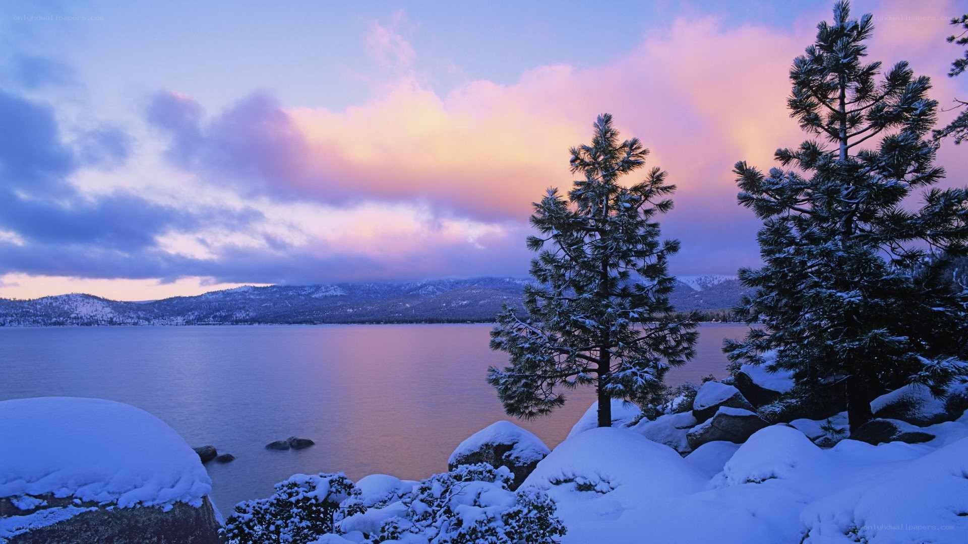 Snowy lake at sunset