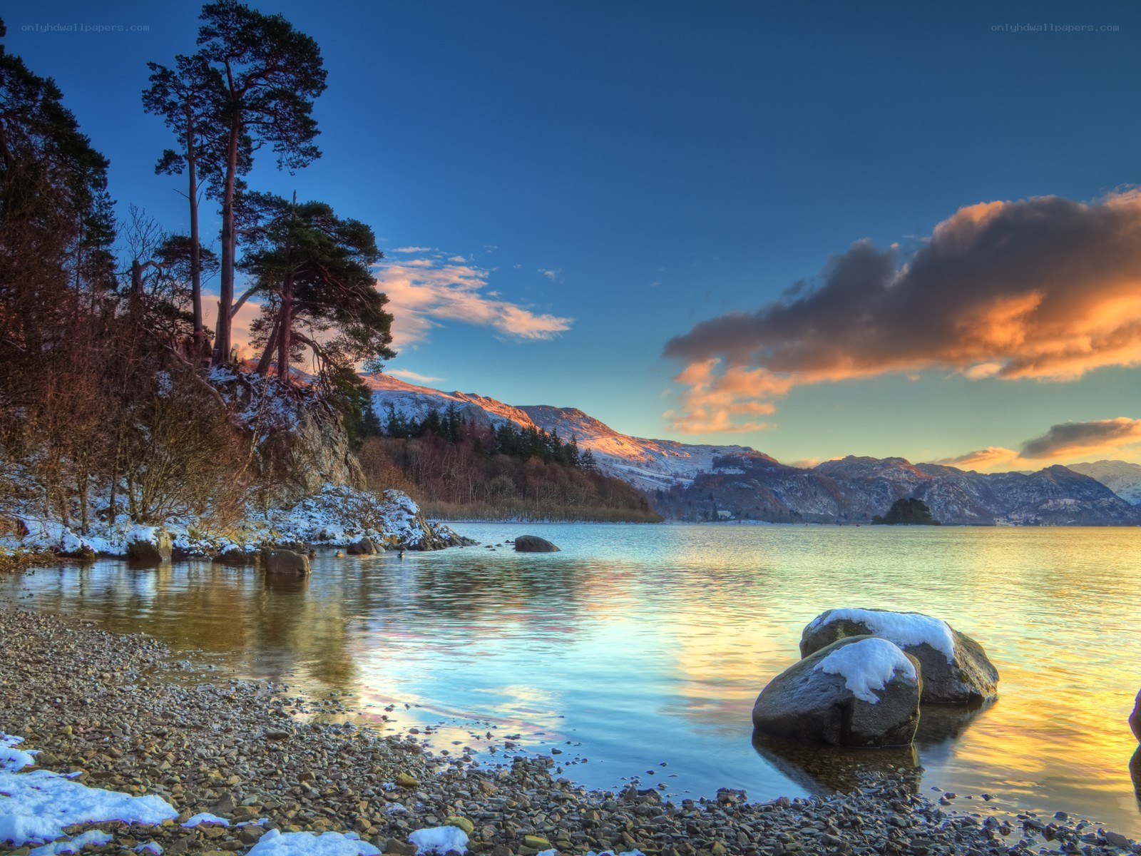 Snowy lake at sunset
