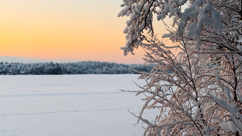 Snowy lake at sunset