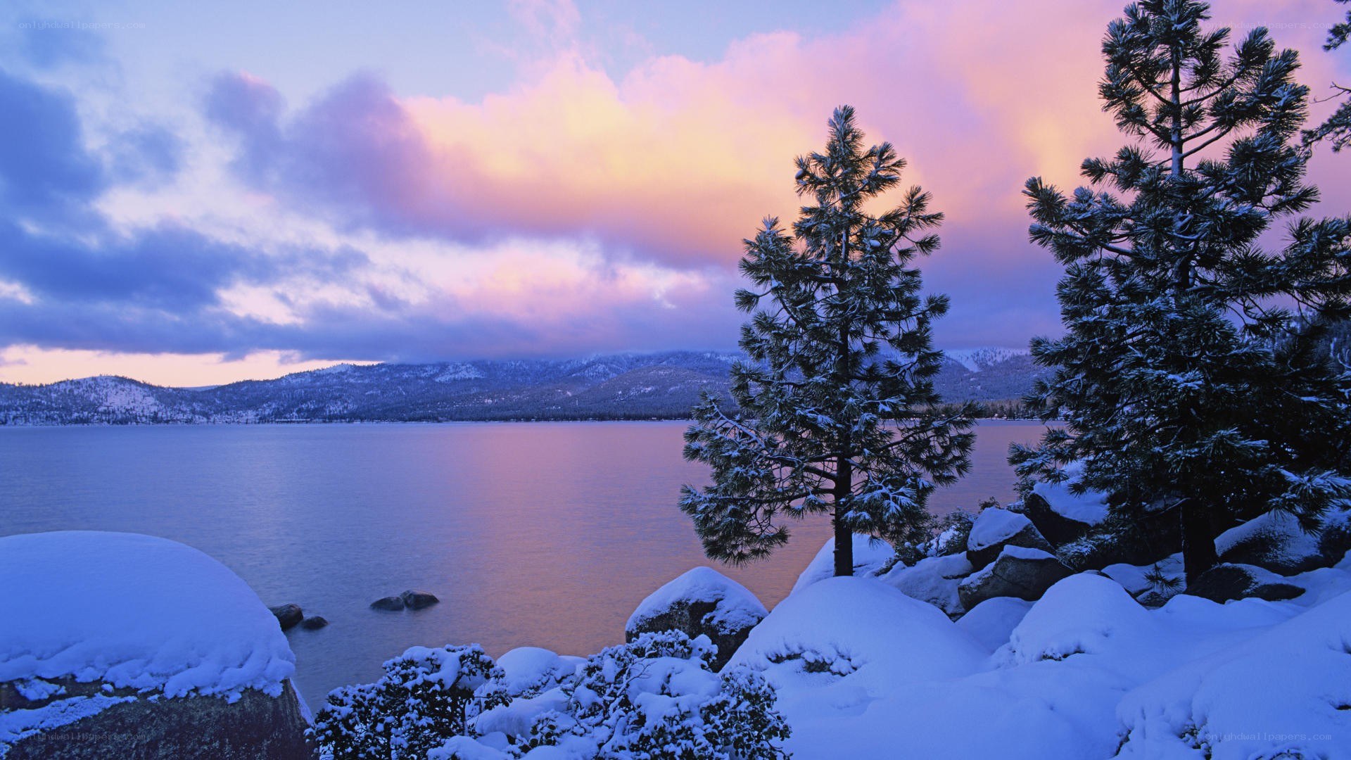 Snowy lake at sunset
