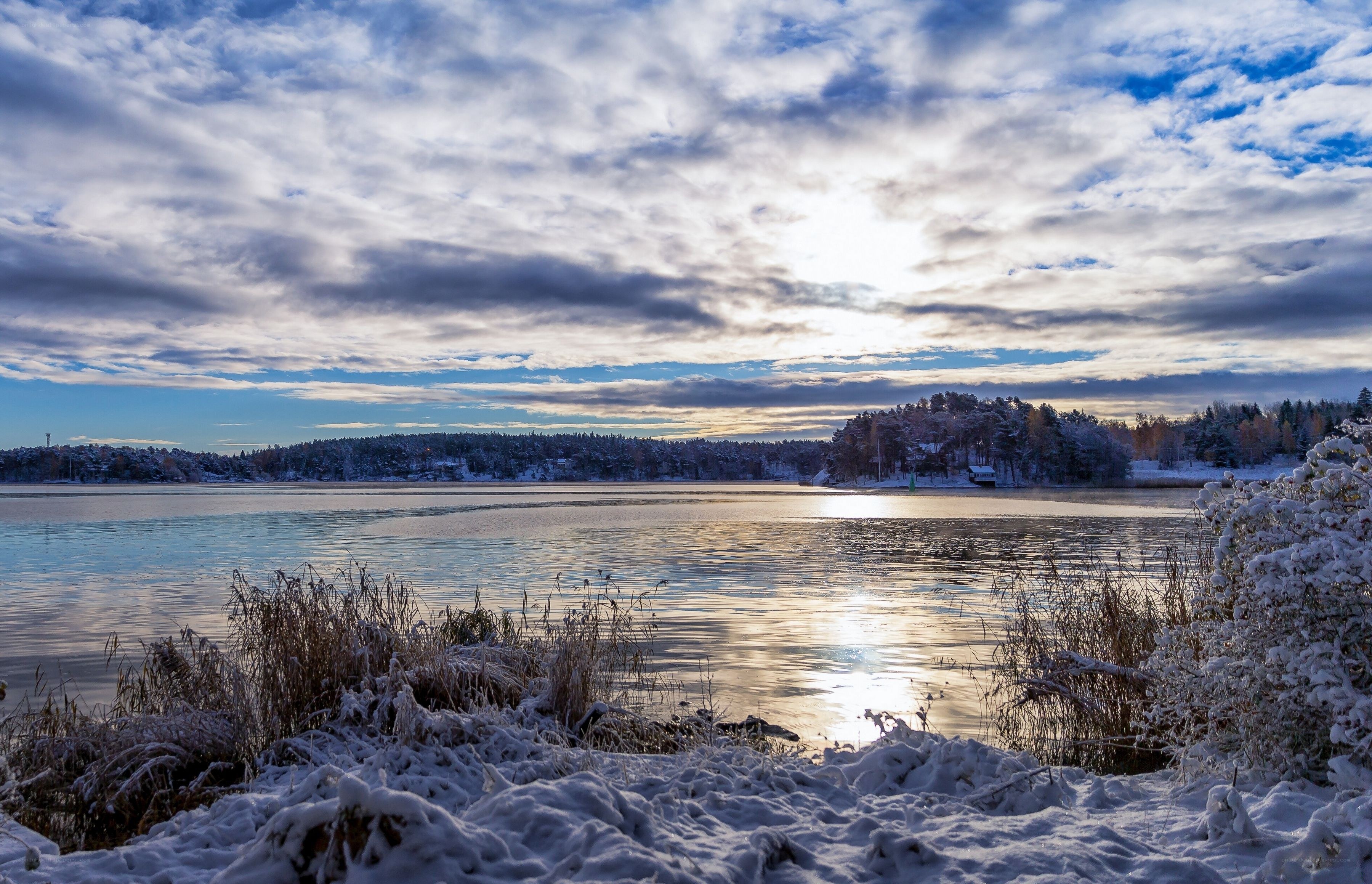 Snowy lake at sunset