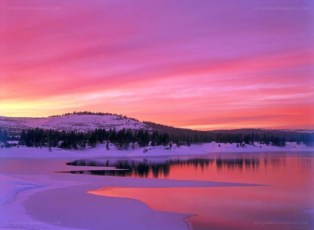 Snowy lake at sunset