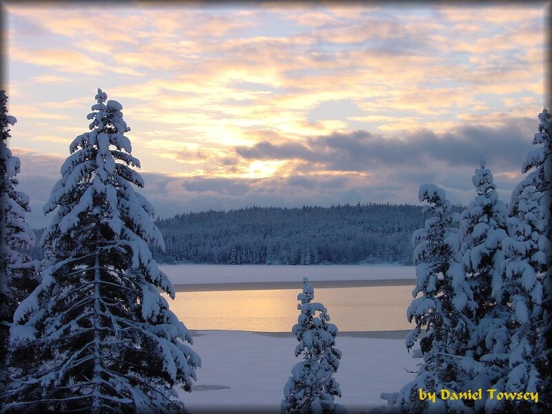 Snowy lake at sunset