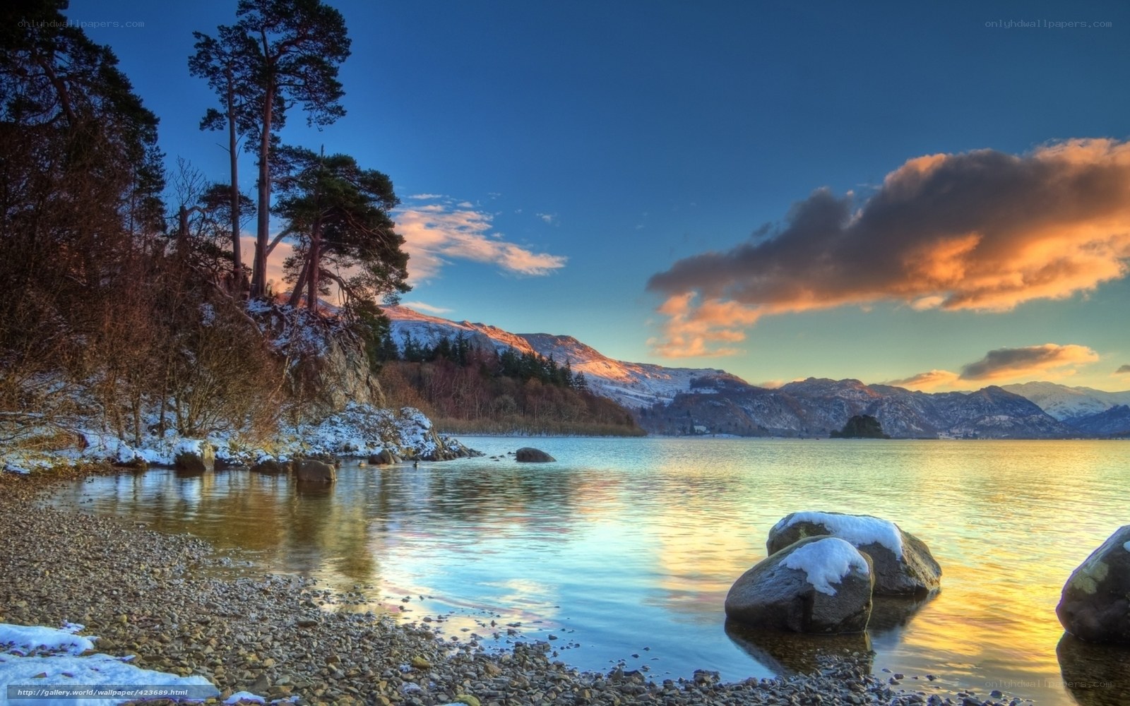 Snowy lake at sunset