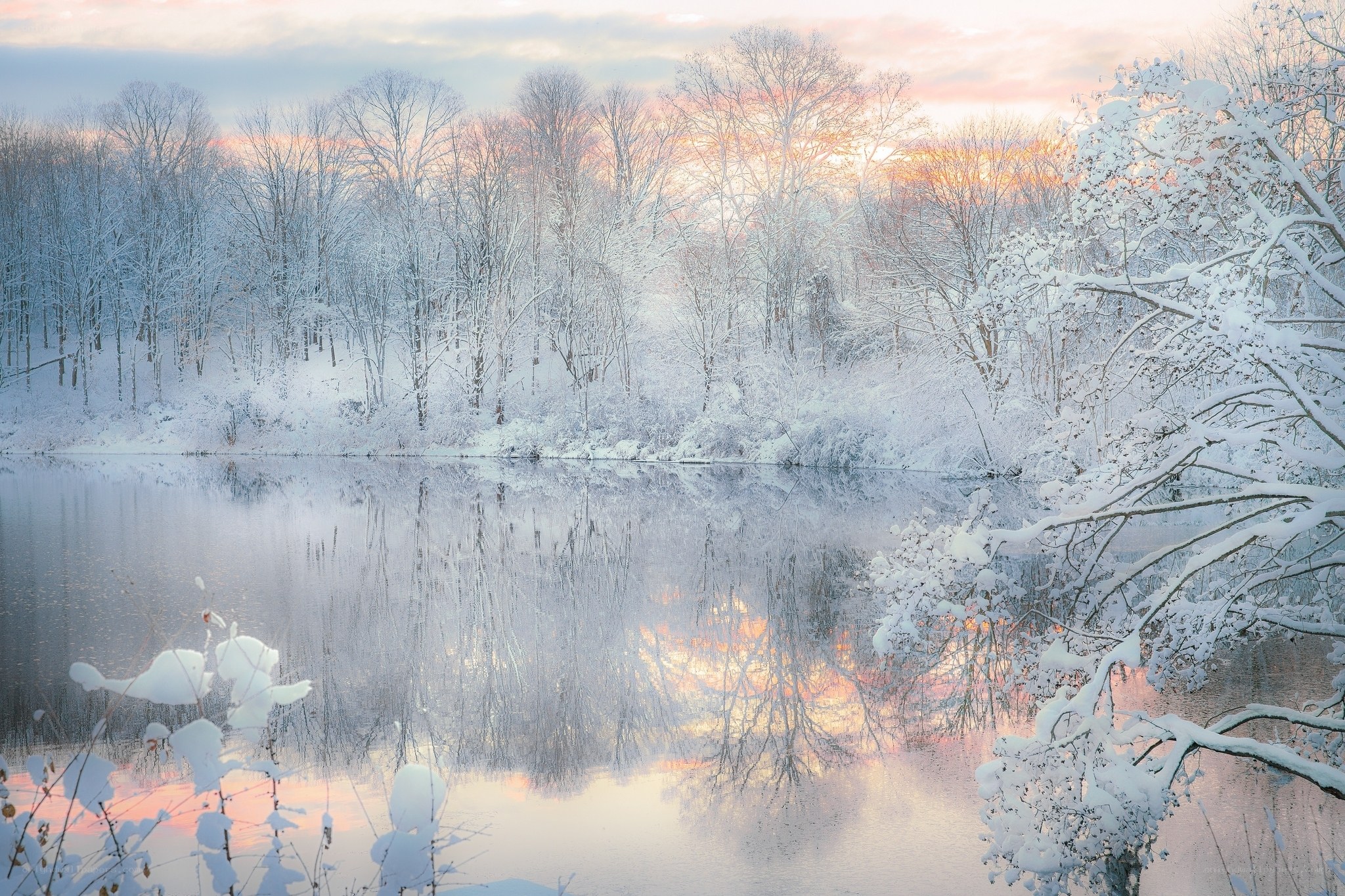 Snowy lake at sunset