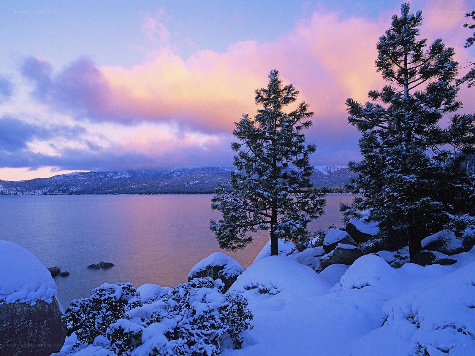 Snowy lake at sunset