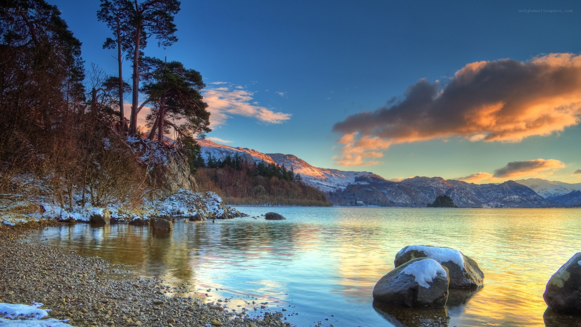 Snowy lake at sunset