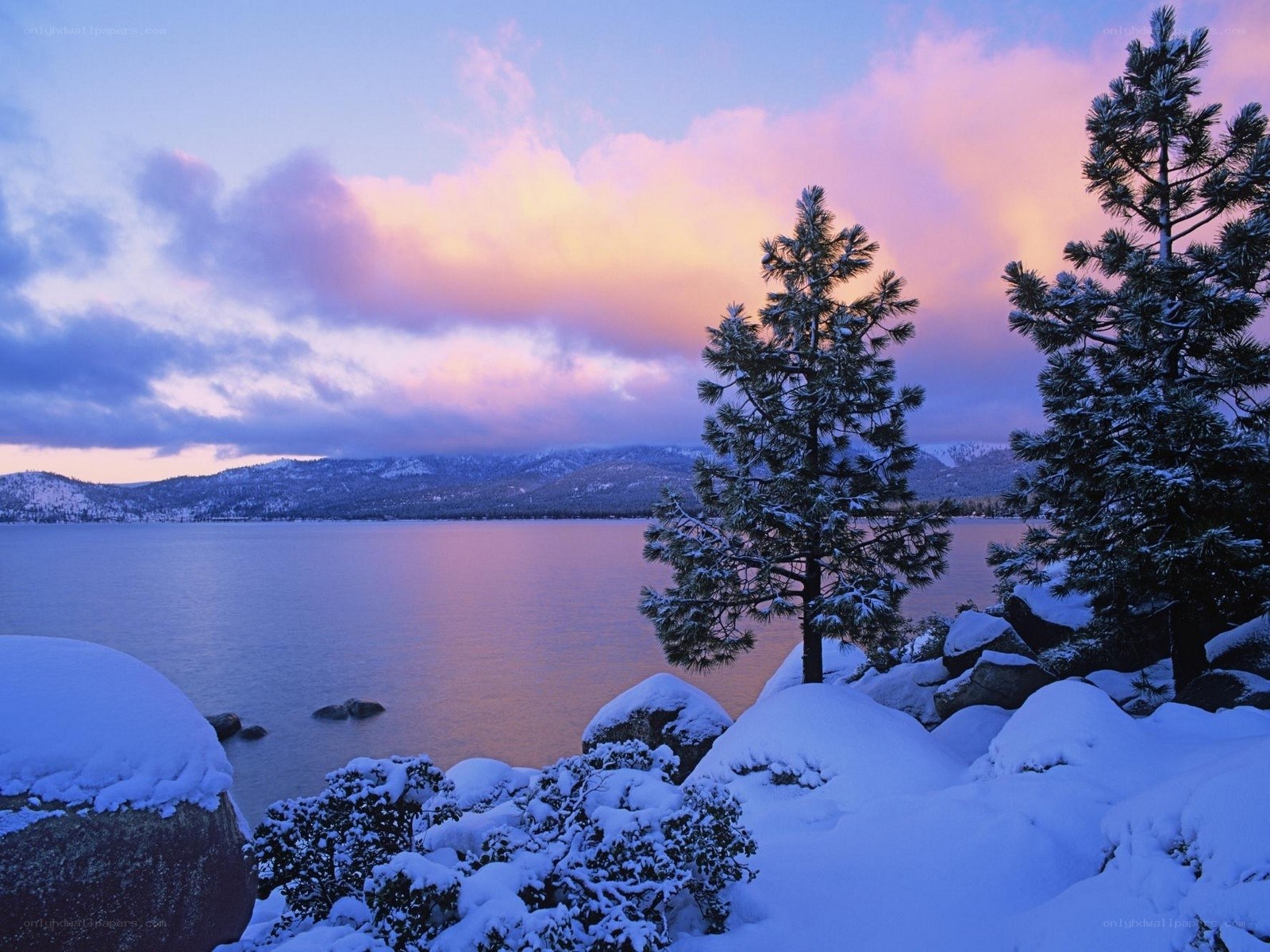 Snowy lake at sunset