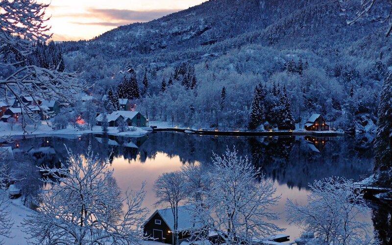 Snowy lake village at dusk