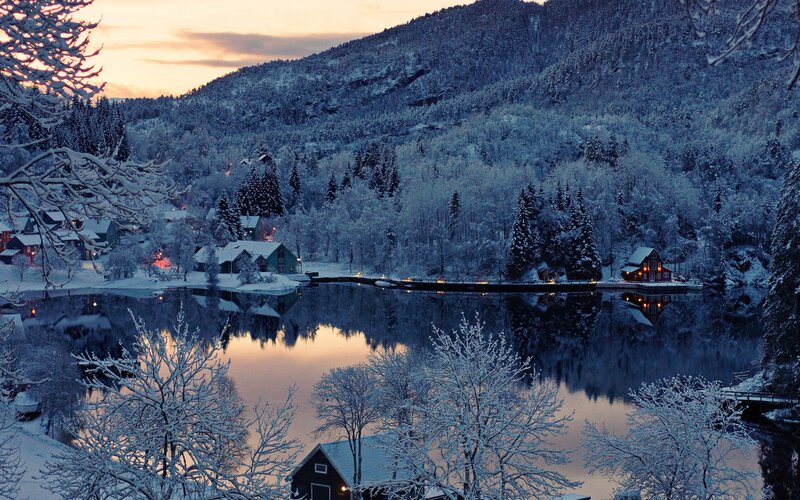 Snowy lake village at dusk