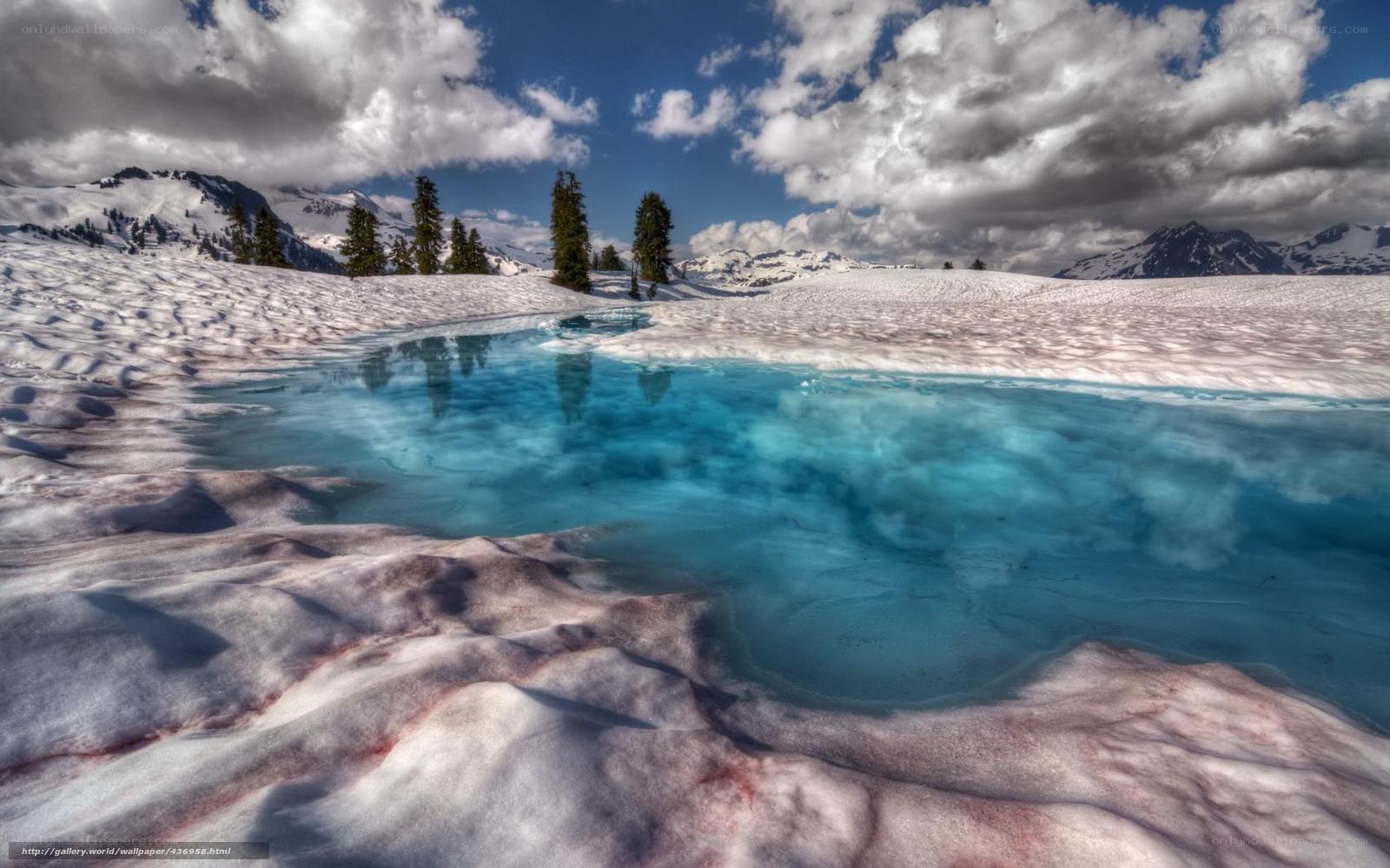 Snowy lake with blue water