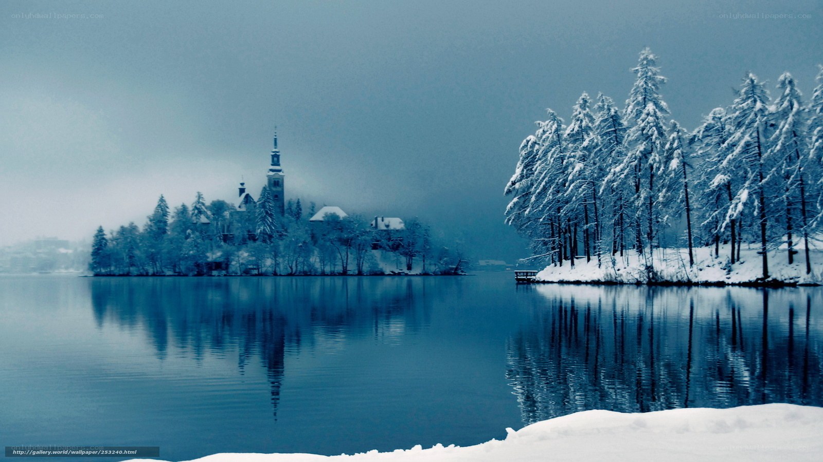Snowy lake with church