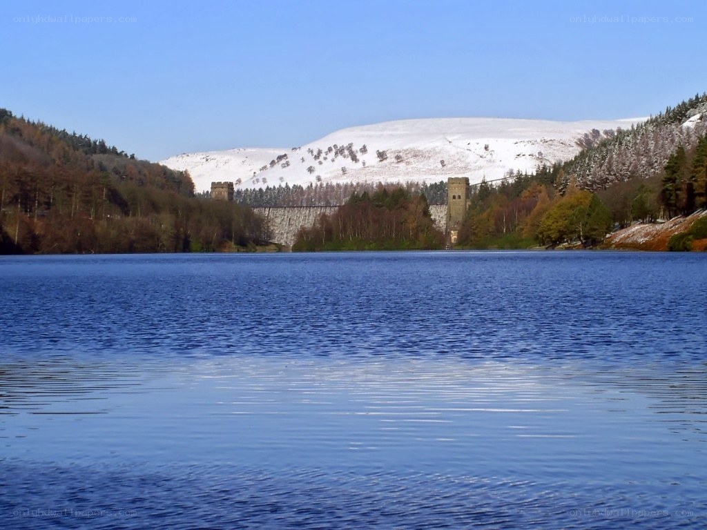Snowy lake with dam