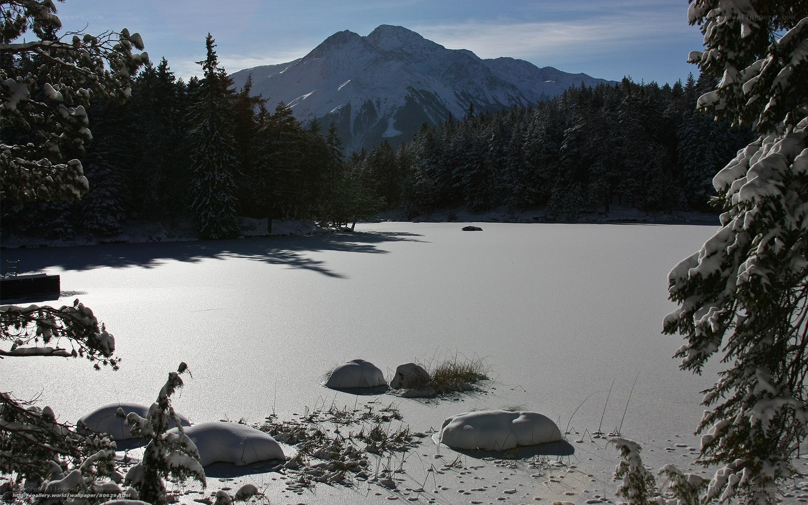 Snowy lake with mountain view