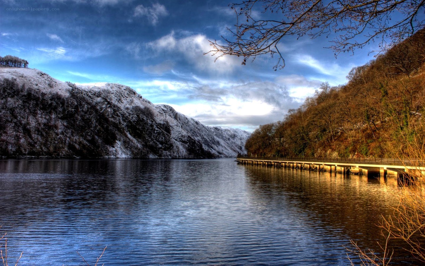 Snowy lake with pier