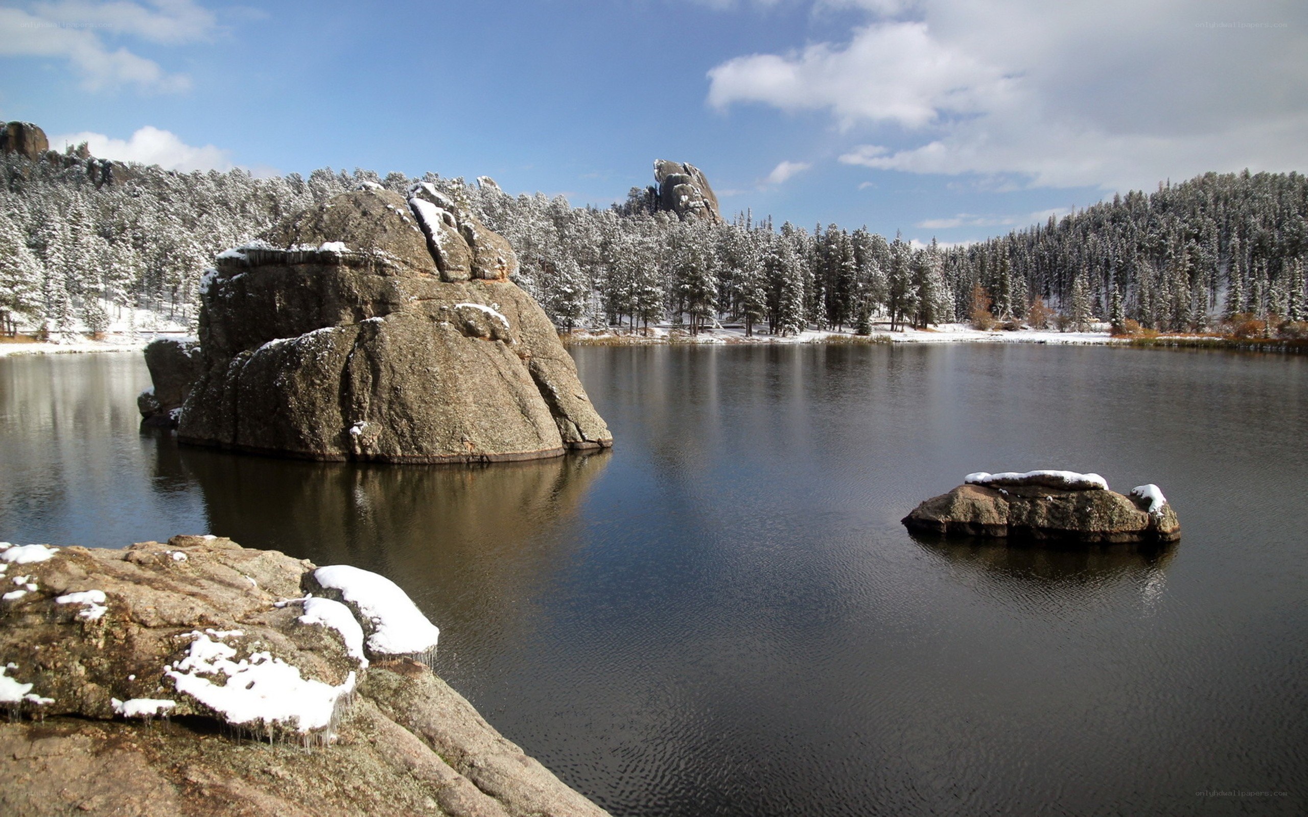 Snowy lake with rock formations