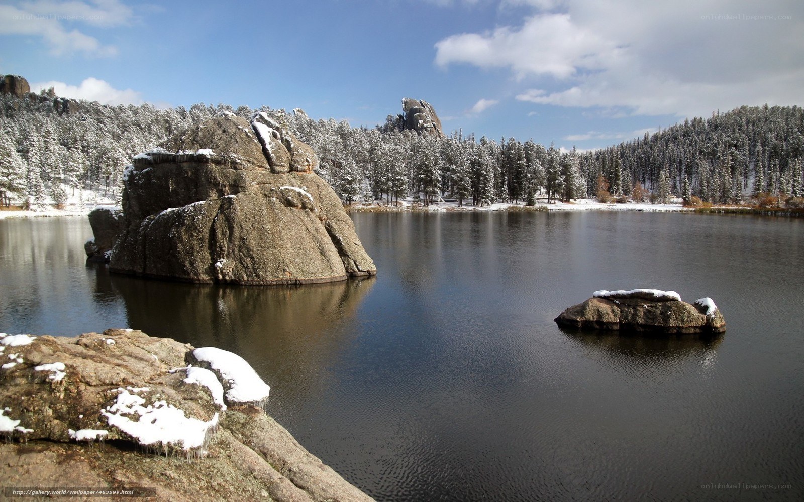 Snowy lake with rock formations