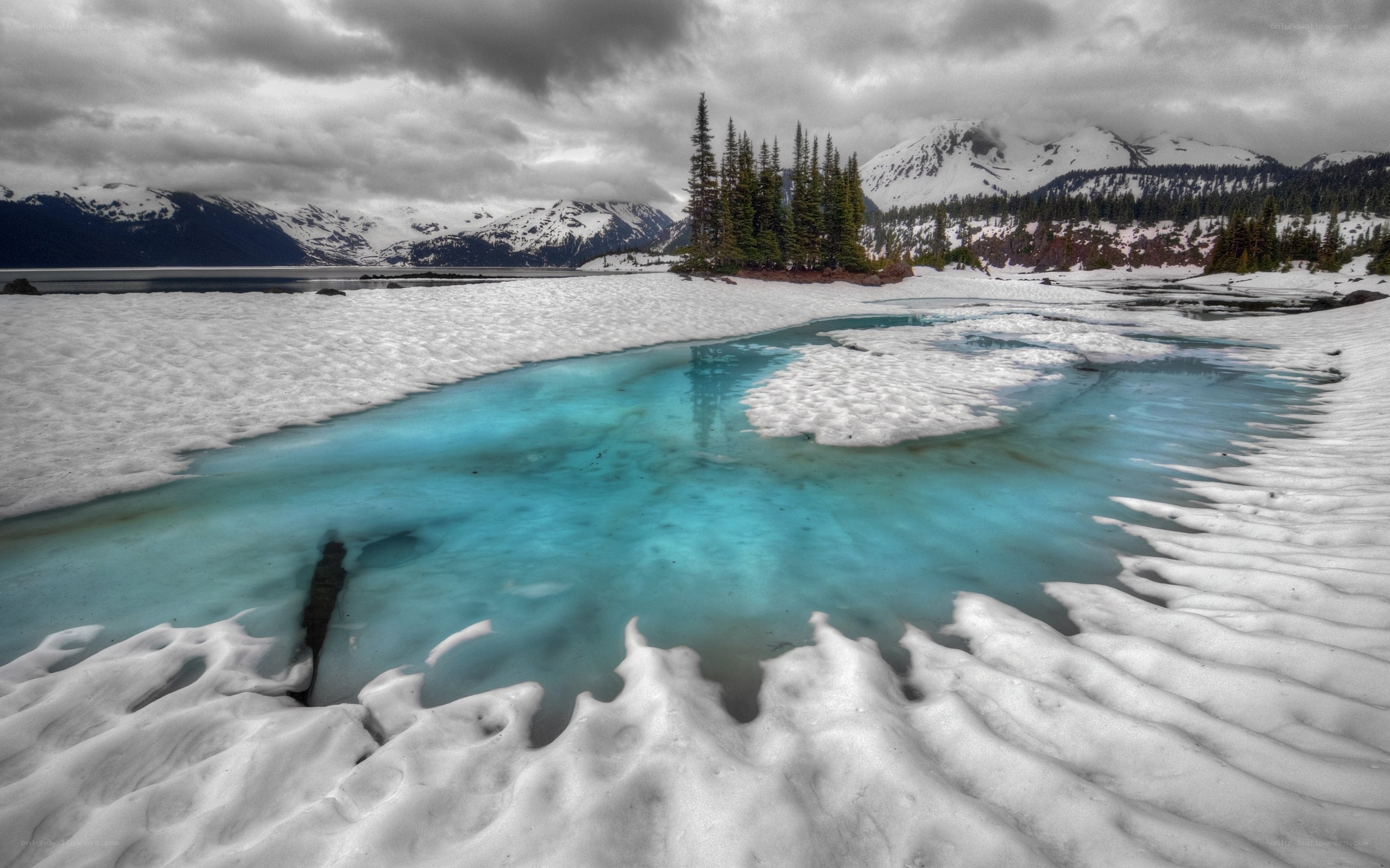 Snowy lake with turquoise water
