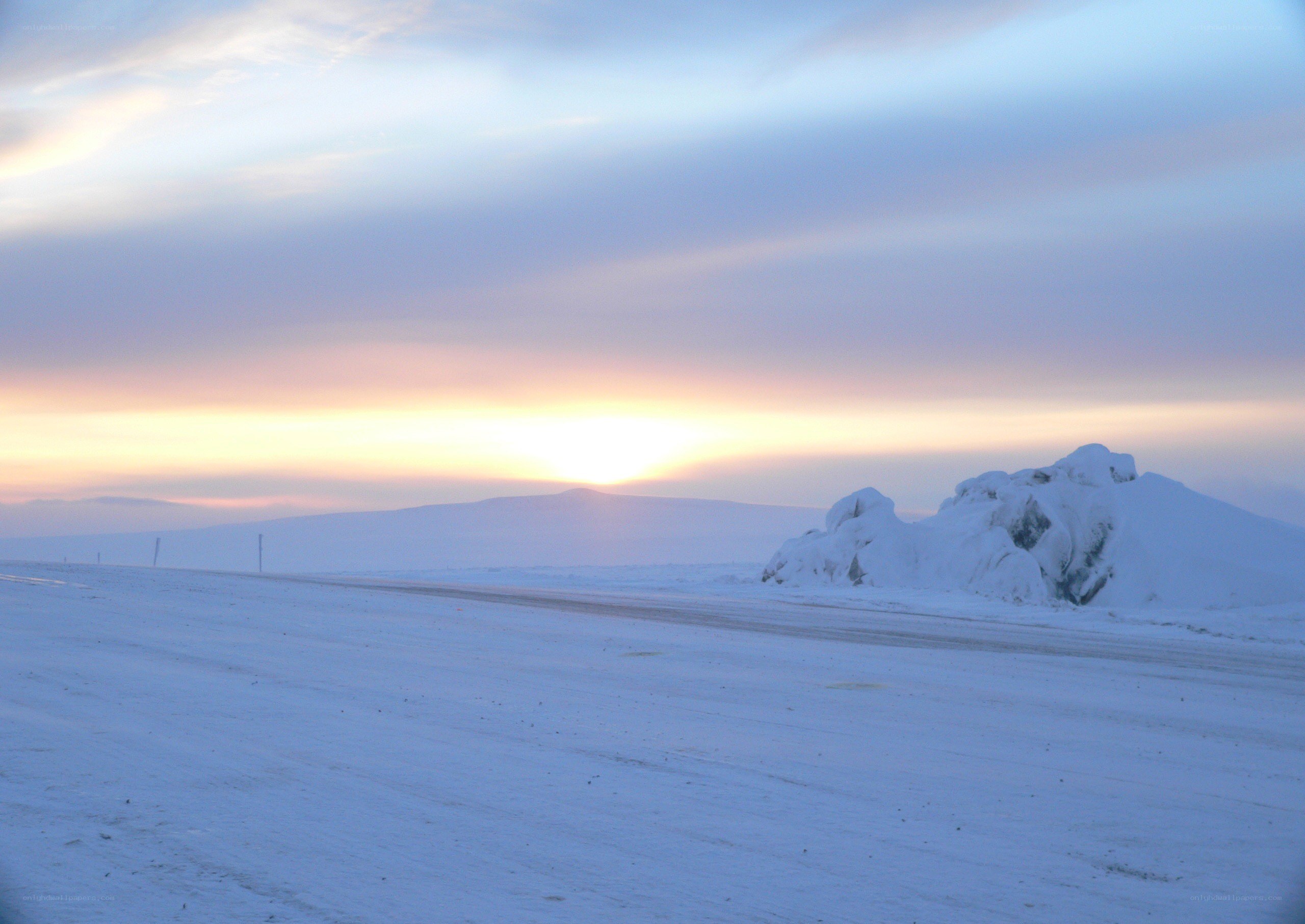 Snowy landscape at sunset